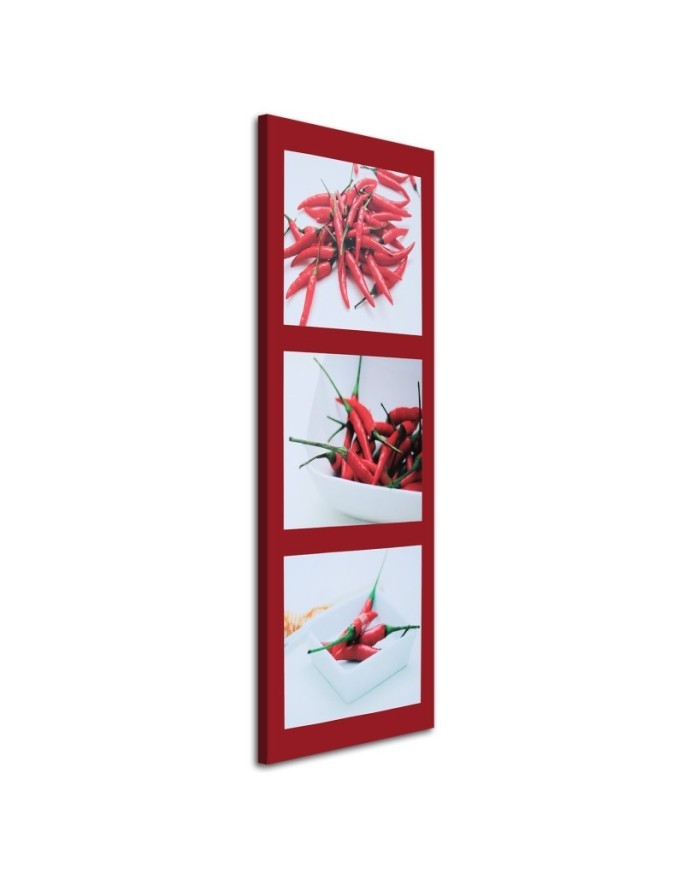 Canvas print - Red chilli peppers on a red background | FEEBY
