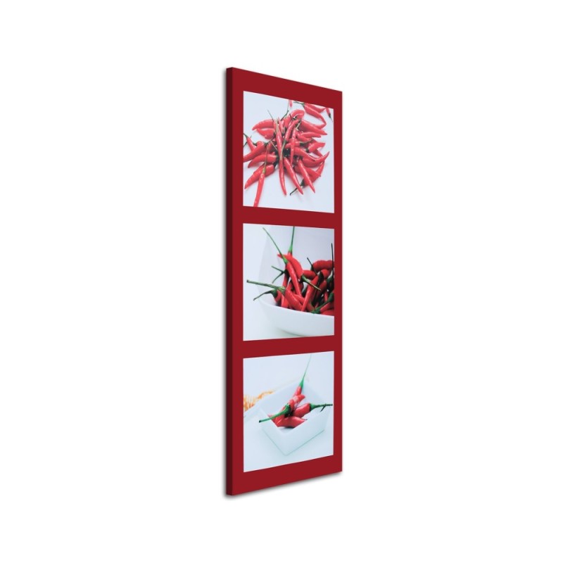 Canvas print - Red chilli peppers on a red background | FEEBY