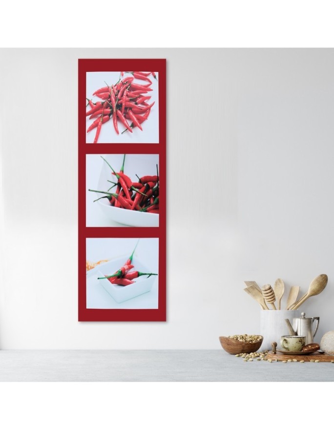 Canvas print - Red chilli peppers on a red background | FEEBY